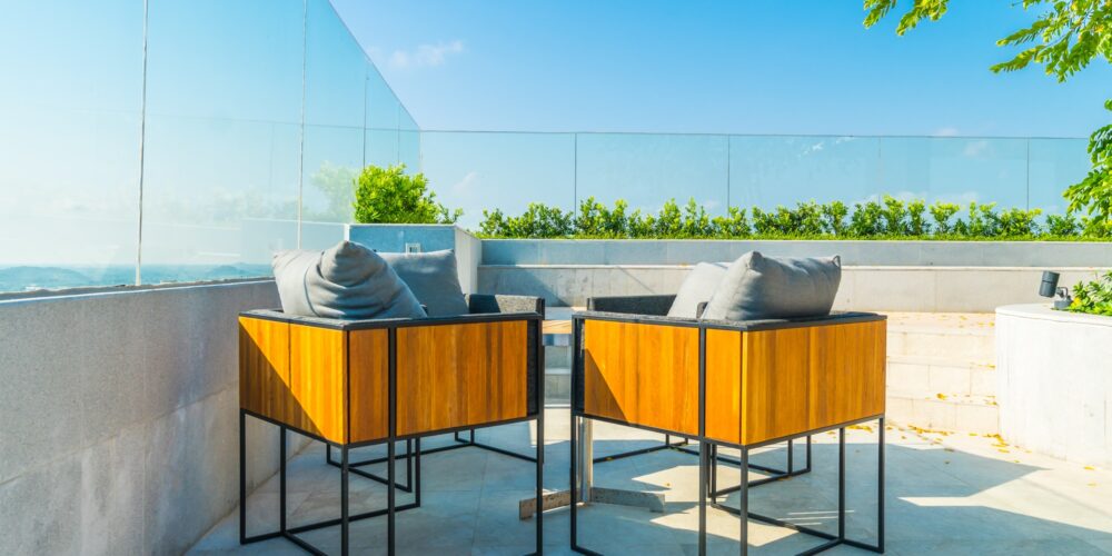 Outdoor patio decoration with char and table on blue sky